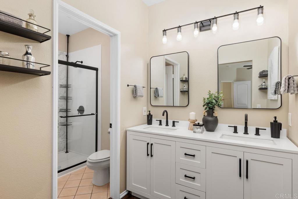 160 Belflora Way Oceanside, CA 92057 - Photo 22 of 41 a bathroom with a double vanity sink mirror and toilet