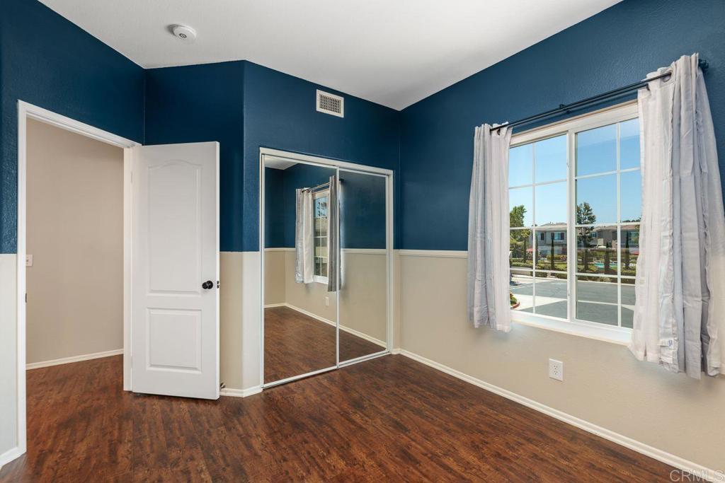 160 Belflora Way Oceanside, CA 92057 - Photo 25 of 41 a view of a hallway with wooden floor and staircase