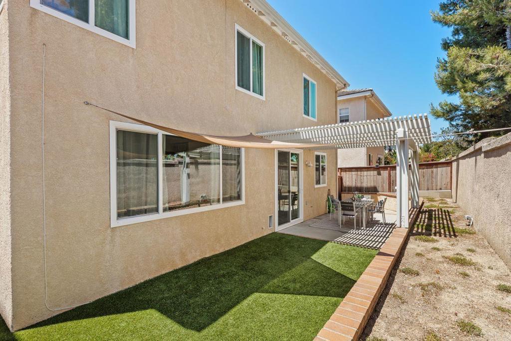 160 Belflora Way Oceanside, CA 92057 - Photo 34 of 41 a front view of a house with a yard garden and patio