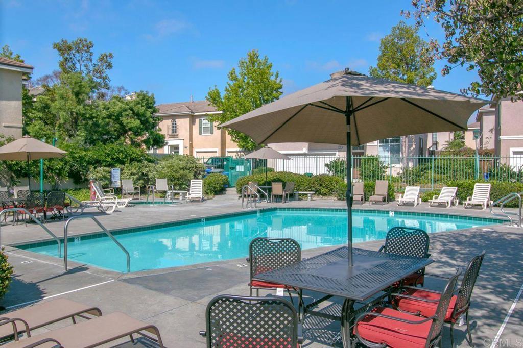 160 Belflora Way Oceanside, CA 92057 - Photo 39 of 41 a view of a table and chairs under an umbrella