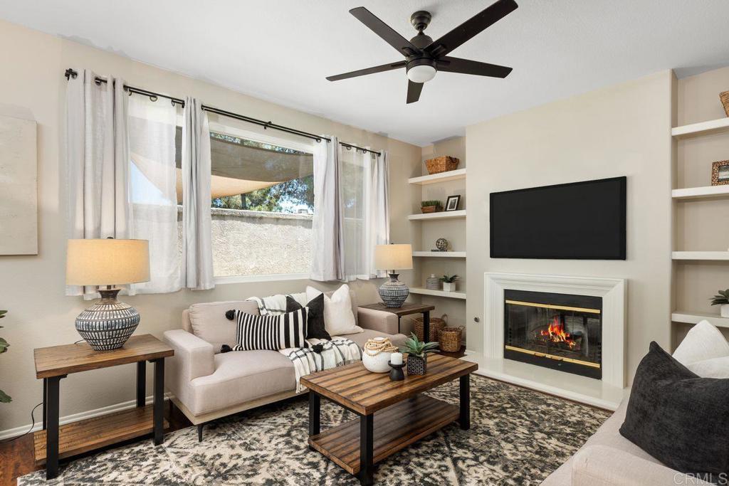 160 Belflora Way Oceanside, CA 92057 - Photo 9 of 41 a living room with furniture fireplace and a flat screen tv
