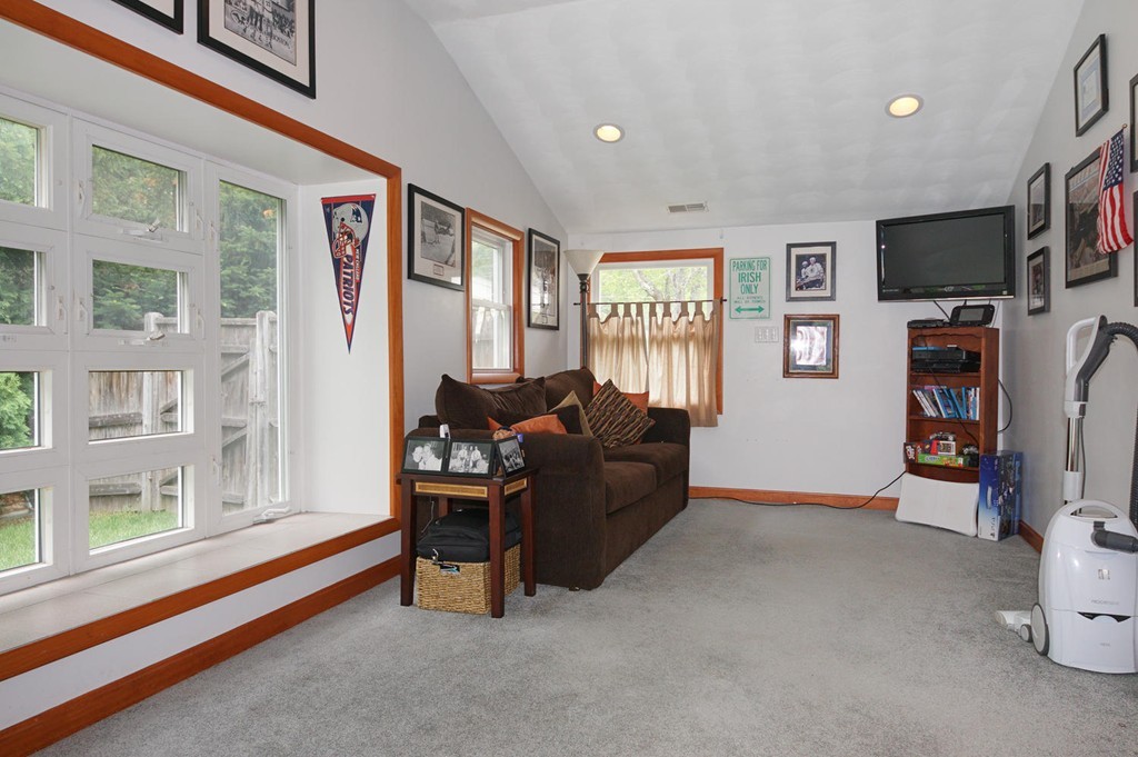 9 Howard Road Chelmsford, MA 01824 - Photo 4 of 13 a living room with furniture and a flat screen tv