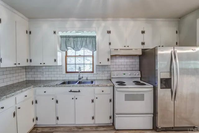 a hallway with a window and wooden floor