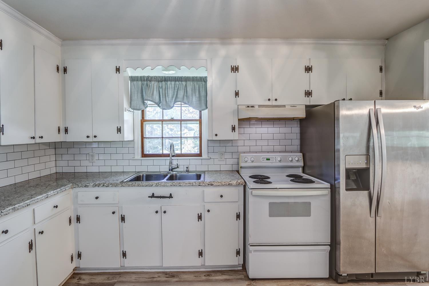 116 Bryant Road Lynchburg, VA 24502 - Photo 12 of 62 a kitchen with cabinets appliances and a window