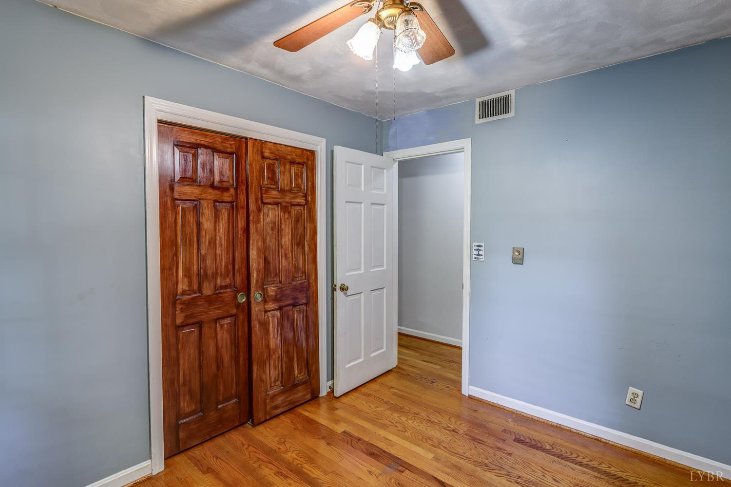 116 Bryant Road Lynchburg, VA 24502 - Photo 22 of 62 an empty room with wooden floor closet and windows
