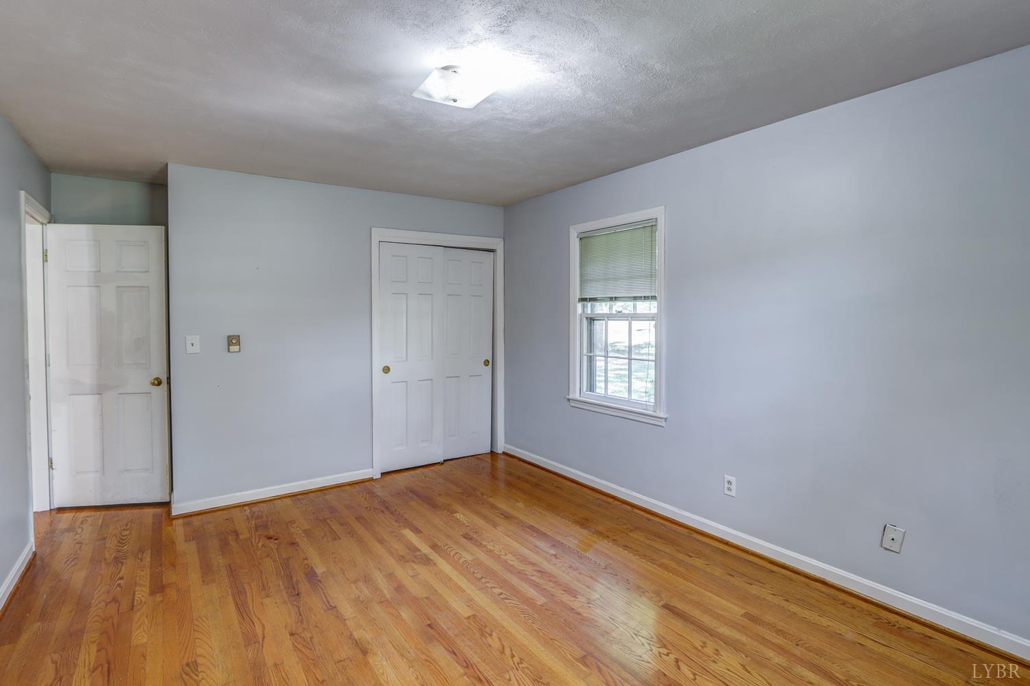 116 Bryant Road Lynchburg, VA 24502 - Photo 24 of 62 wooden floor in an empty room with a window