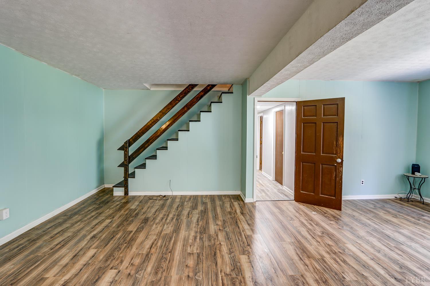 116 Bryant Road Lynchburg, VA 24502 - Photo 33 of 62 a view of hallway with stairs and wooden floor