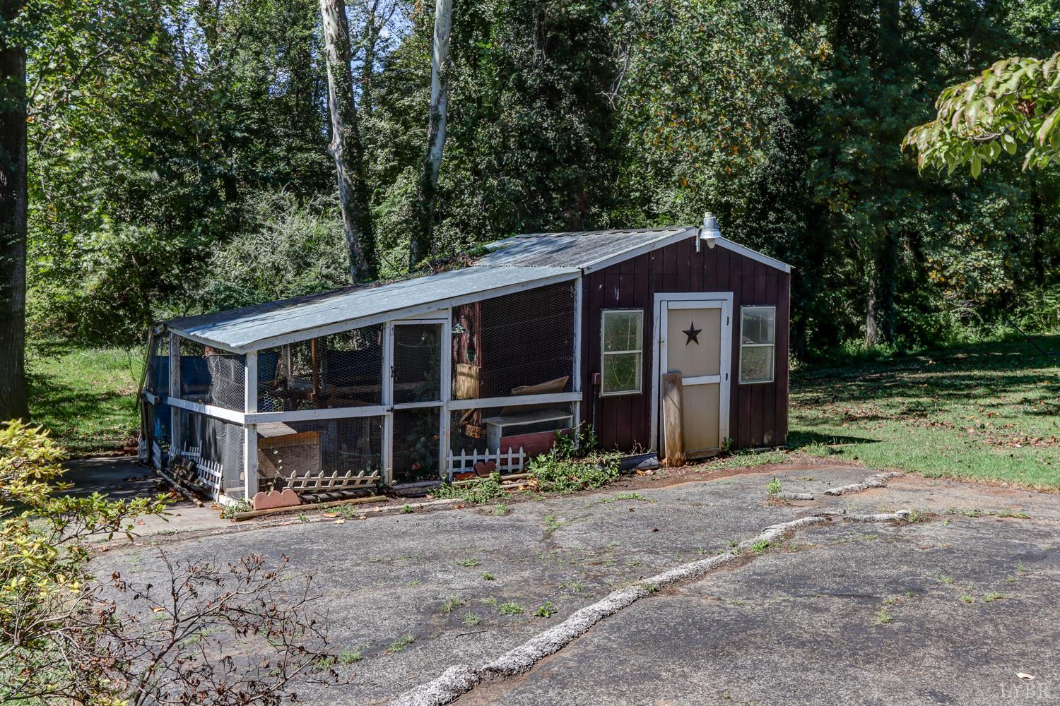 116 Bryant Road Lynchburg, VA 24502 - Photo 48 of 62 a front view of a house with a garden and porch