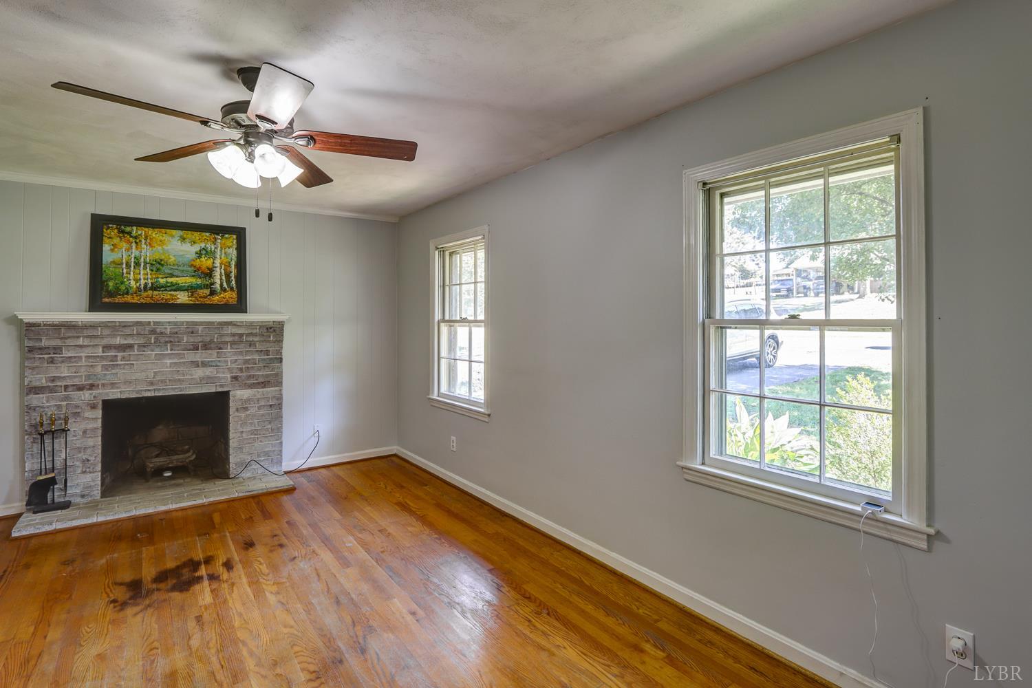 116 Bryant Road Lynchburg, VA 24502 - Photo 5 of 62 a view of an empty room with wooden floor and a window