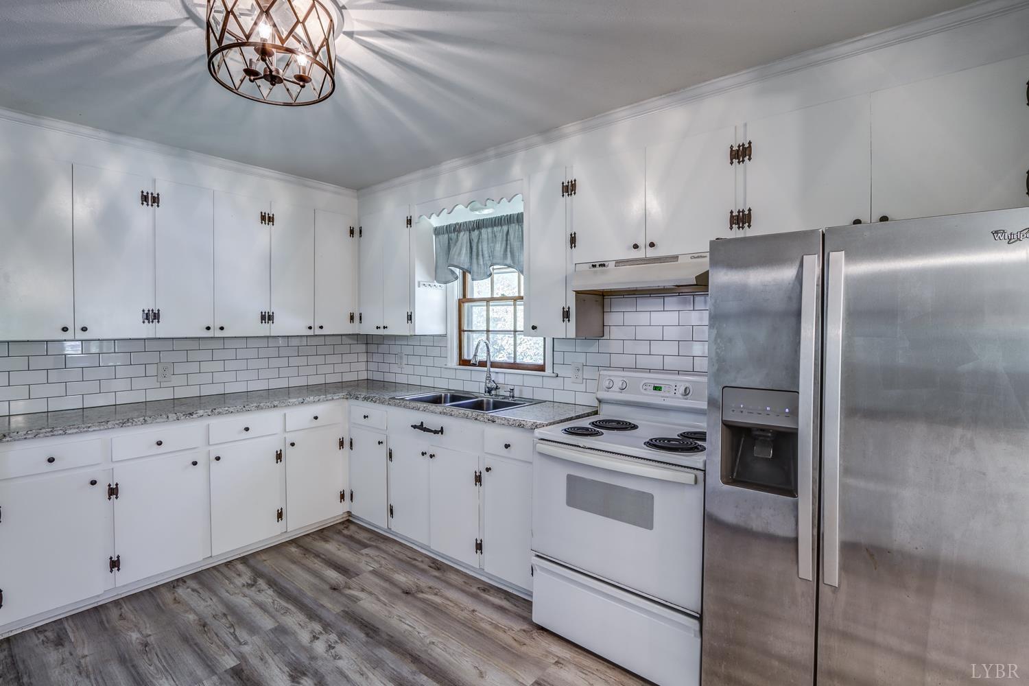 116 Bryant Road Lynchburg, VA 24502 - Photo 10 of 62 a kitchen with granite countertop white cabinets and stainless steel appliances