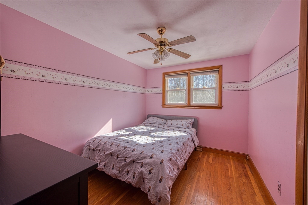 12 Brewster Road Randolph, MA 02368 - Photo 14 of 27 a bedroom with a bed and a window