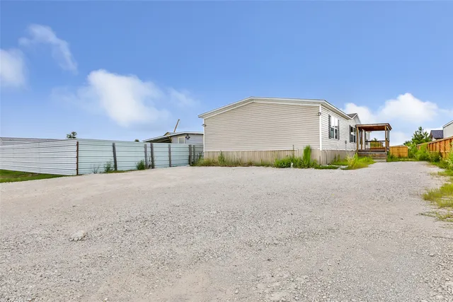 a view of a house with a street