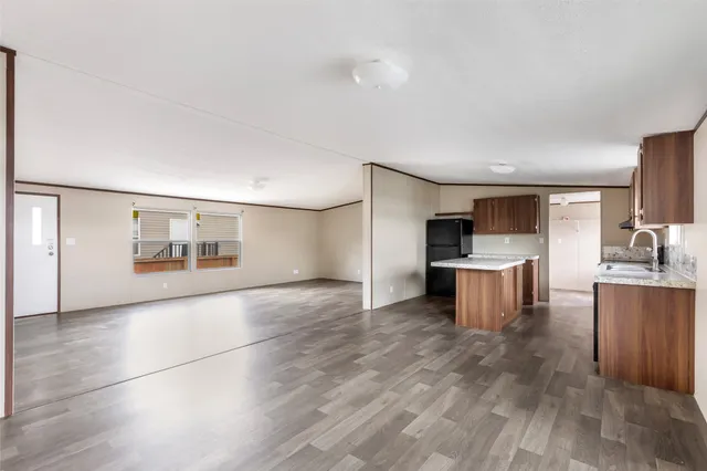 a view of kitchen with microwave and cabinets