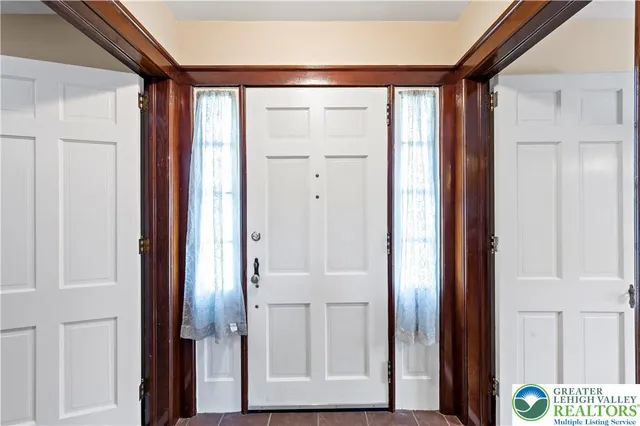 an entryway with wooden floor