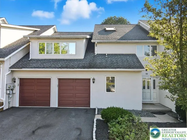 a front view of a house with yard