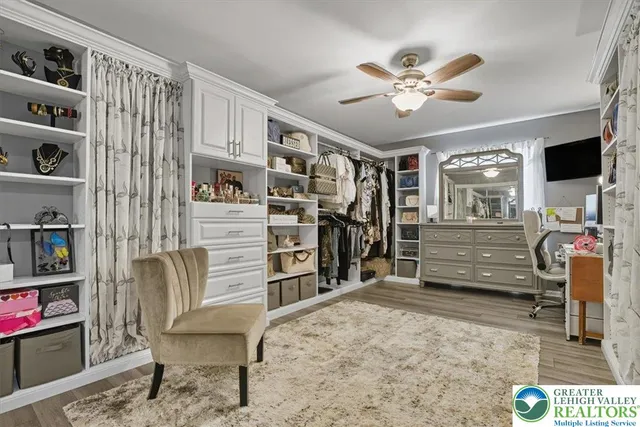 a view of a livingroom with furniture and a window