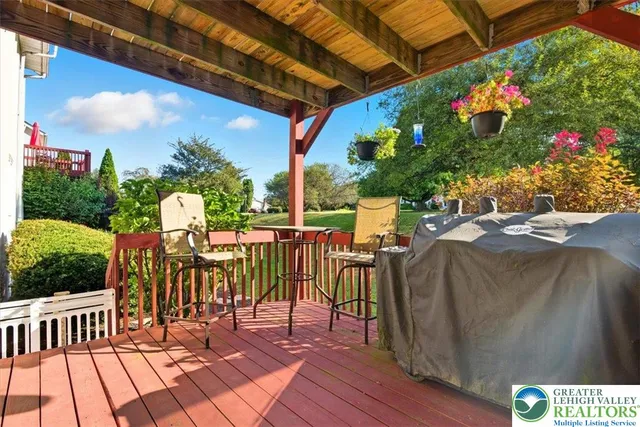 a view of a patio with table and chairs and potted plants
