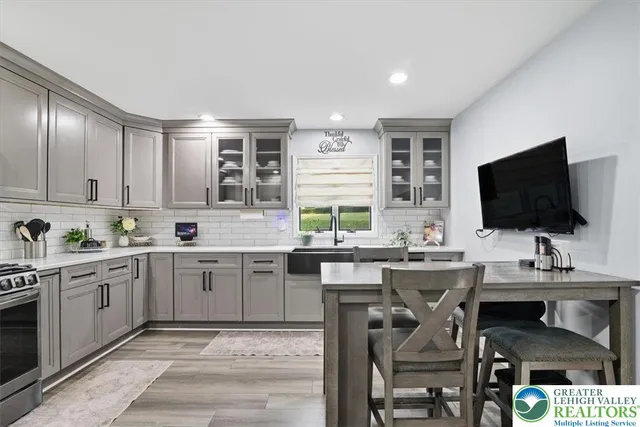 a kitchen with a sink cabinets and window