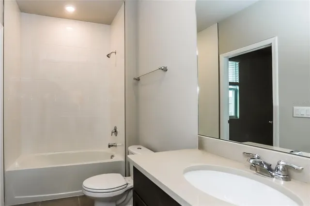 a view of white house with a yard