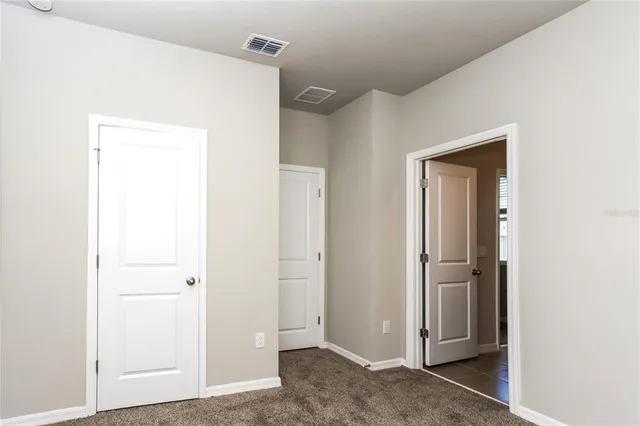 a view of a hallway with closet