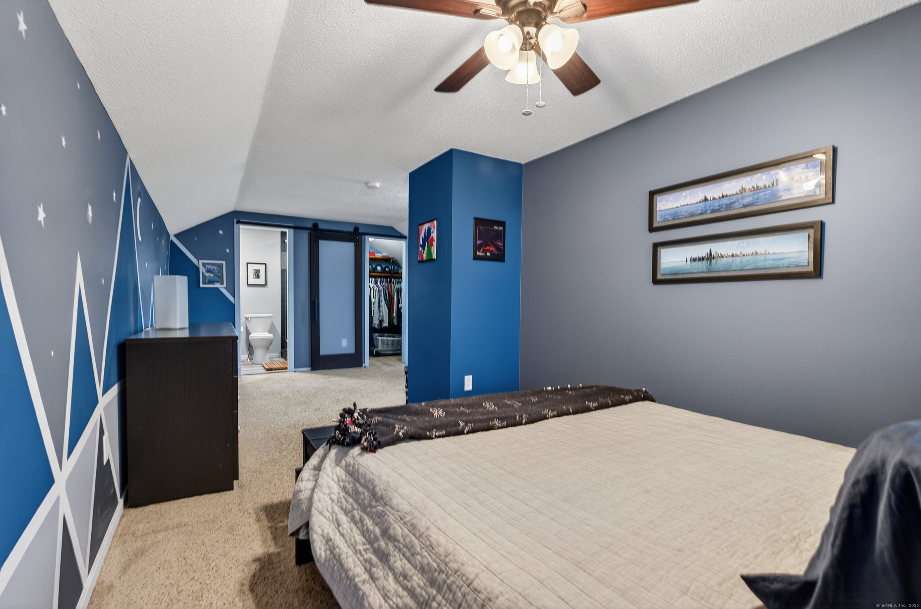 3 Sun Ridge Lane, Unit 3 Cromwell, CT 06416 - Photo 30 of 38 a bedroom with a large bed and a chandelier