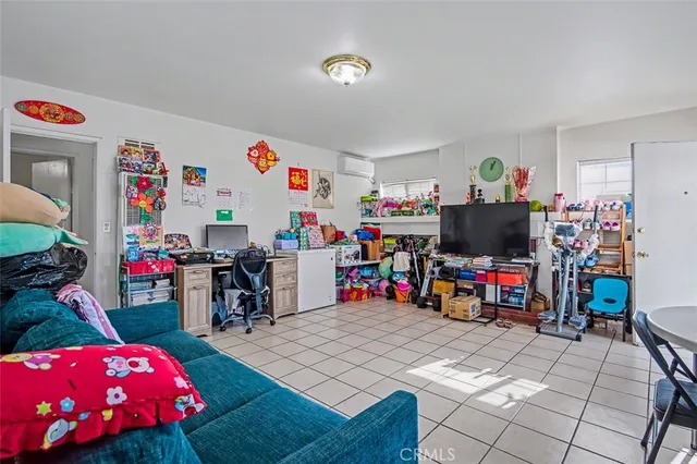 a living room with lots of furniture and a flat screen tv