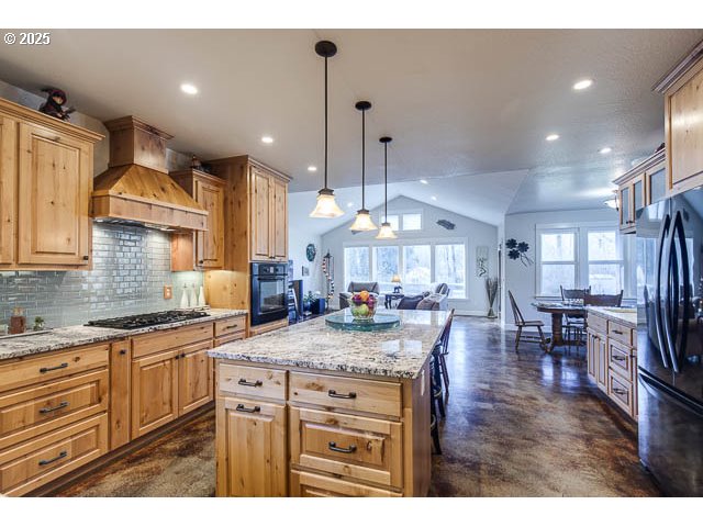 22243 Hiawatha Road Rhododendron, OR 97049 - Photo 14 of 42 a kitchen with lots of counter space and dining table