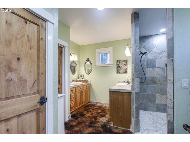 22243 Hiawatha Road Rhododendron, OR 97049 - Photo 18 of 42 a bathroom with a granite countertop sink a shower and a mirror