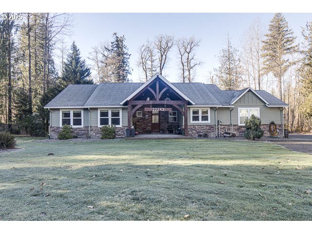 22243 Hiawatha Road Rhododendron, OR 97049 - Photo 2 of 42 a front view of a house with a yard