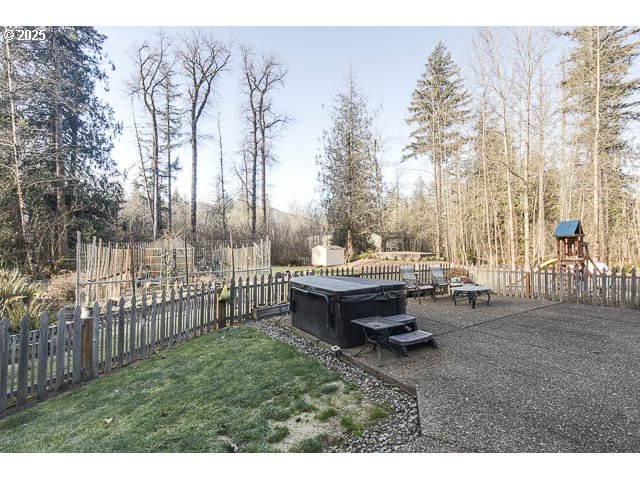 22243 Hiawatha Road Rhododendron, OR 97049 - Photo 25 of 42 a backyard of a house with table and chairs