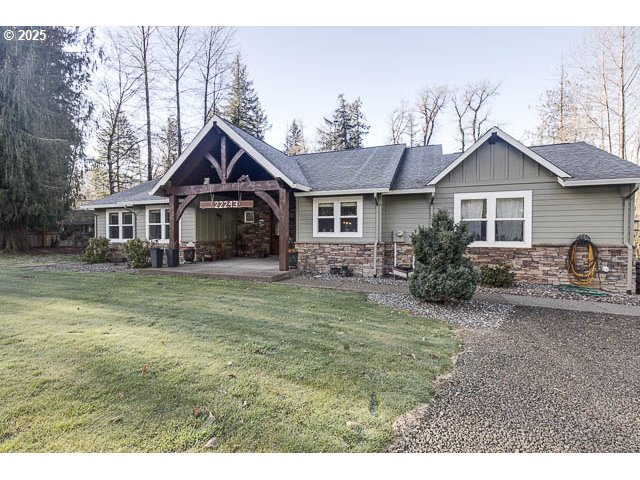 22243 Hiawatha Road Rhododendron, OR 97049 - Photo 8 of 42 a front view of a house with garden