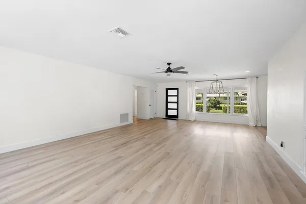 a kitchen with a stove a sink and a refrigerator