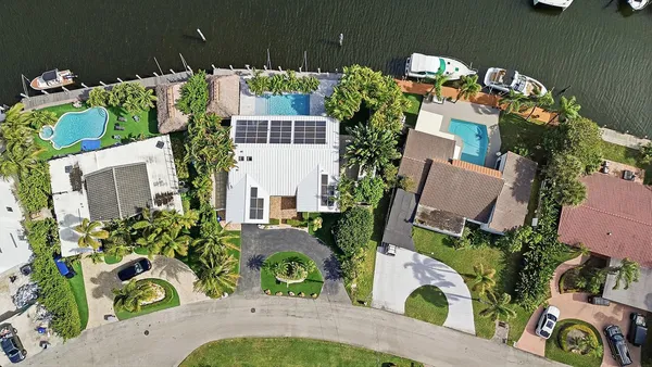 an aerial view of a house with a ocean view