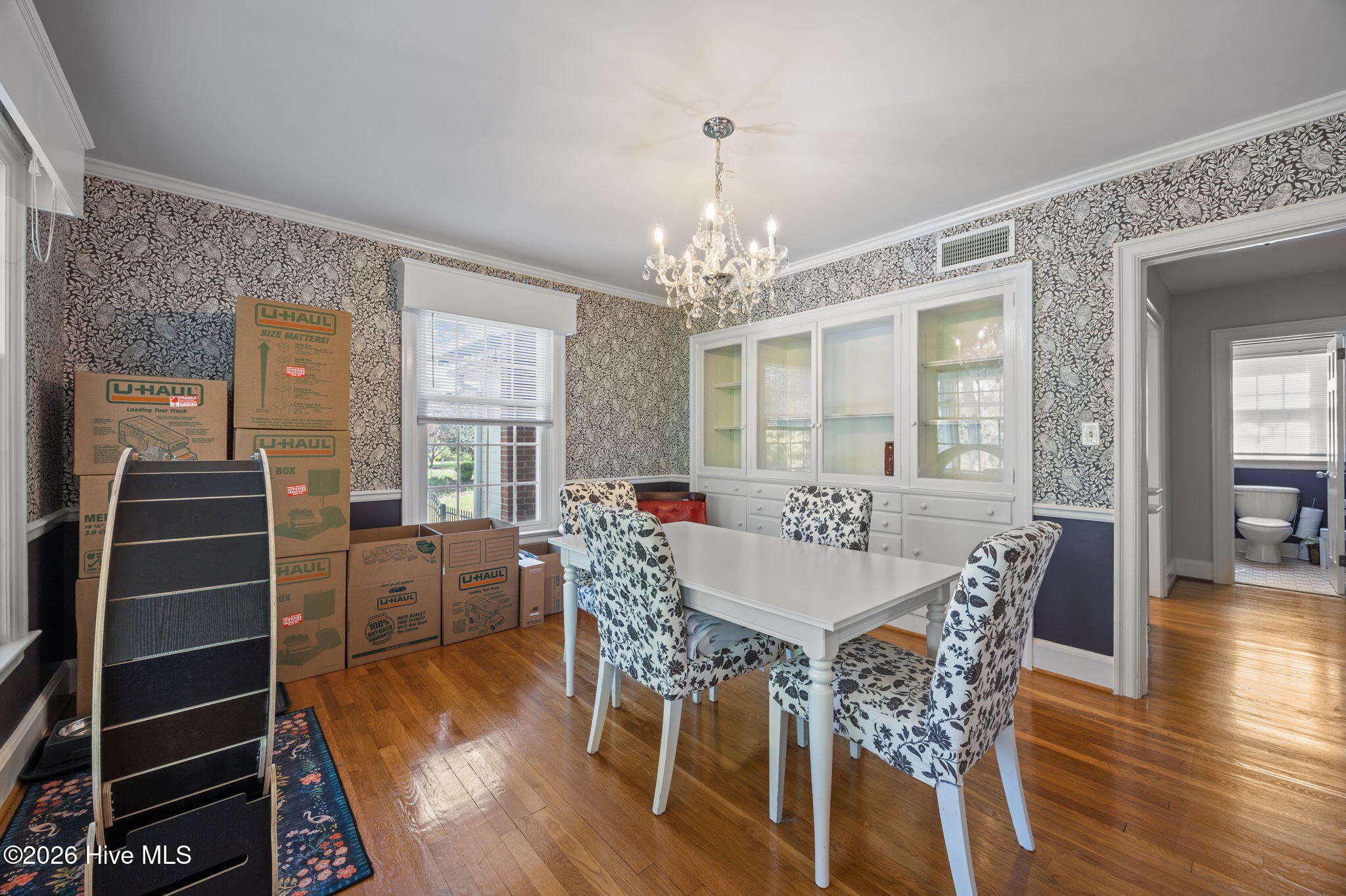 1104 West Rock Spring Road Greenville, NC 27858 - Photo 26 of 56 1st look at Dining Room - Built-In for storage, Kitchen at right, Porch access to left