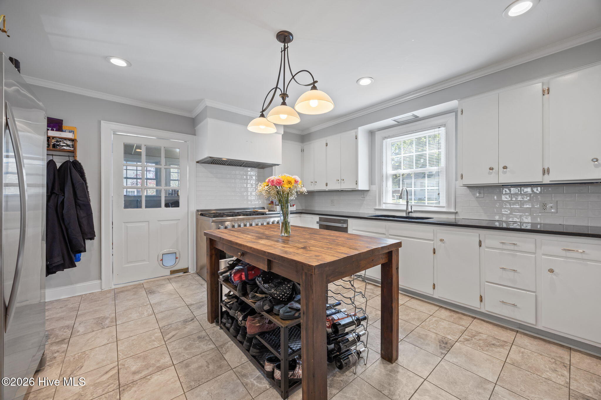 1104 West Rock Spring Road Greenville, NC 27858 - Photo 30 of 56 Door Back Left is to Mud Room/Laundry/Storage that is accessed from Porch at Back Parking