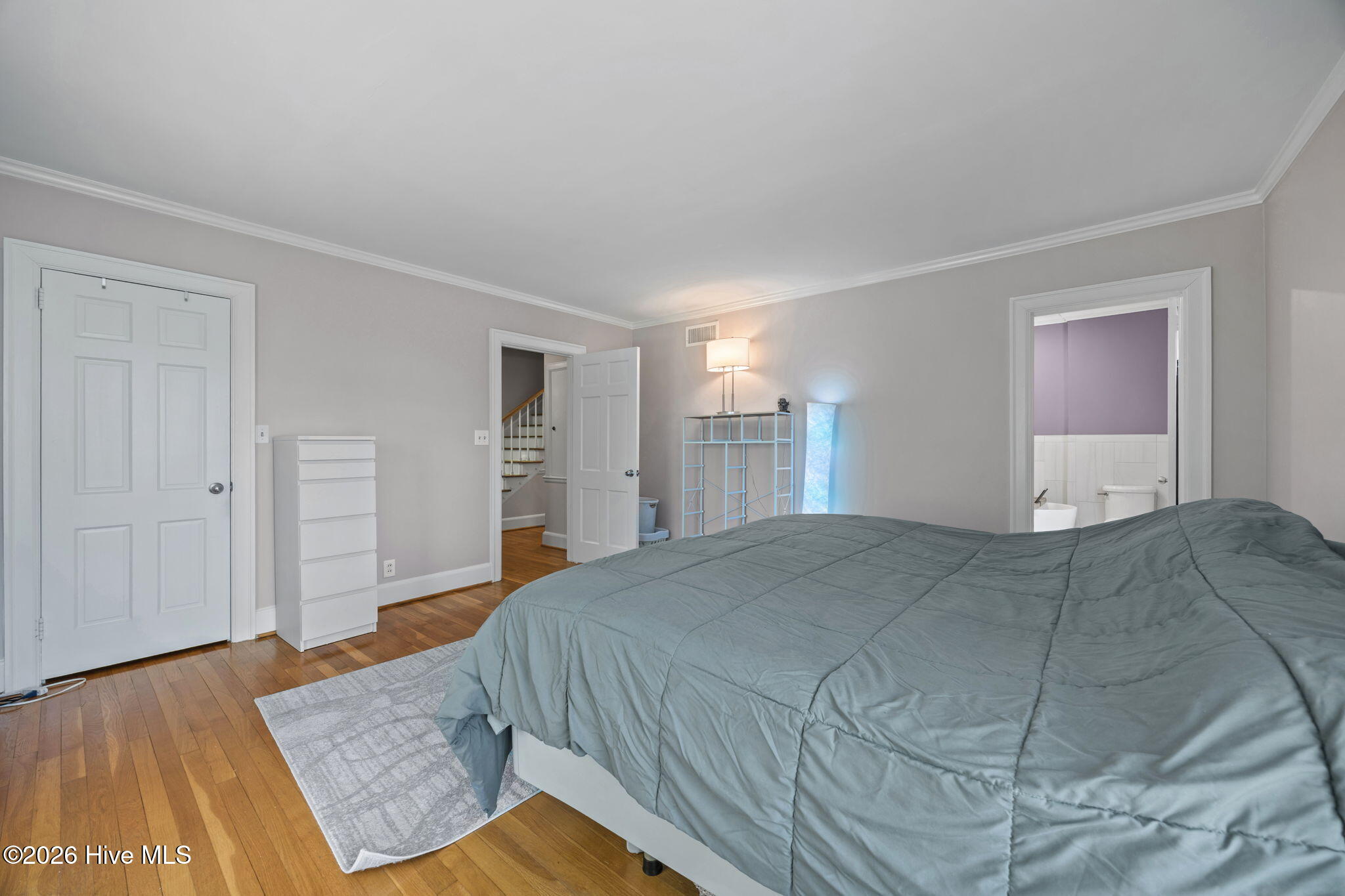 1104 West Rock Spring Road Greenville, NC 27858 - Photo 40 of 56 Closet Space and Ensuite Bath - Hardwood Continues