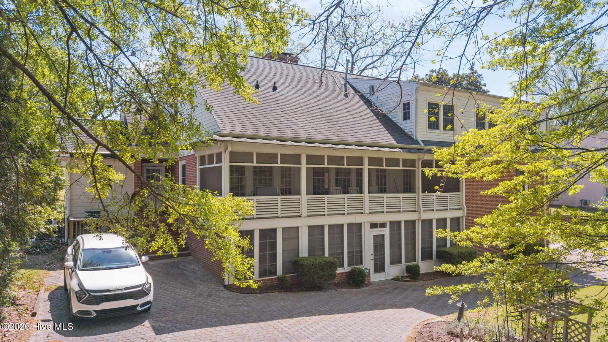 1104 West Rock Spring Road Greenville, NC 27858 - Photo 8 of 56 Spring Leaves & Blossoms - Back Entry Behind White Vehicle