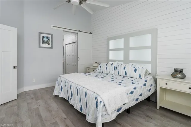 a bedroom with a bed and a table