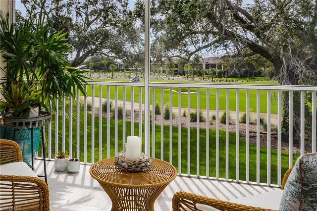a view of a patio with a yard table and chairs