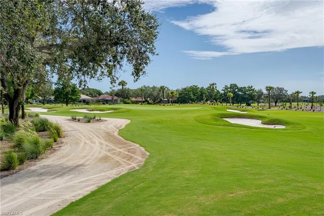 a view of a golf course with a lake
