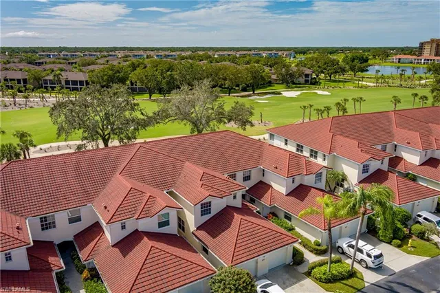 an aerial view of a house with a ocean view