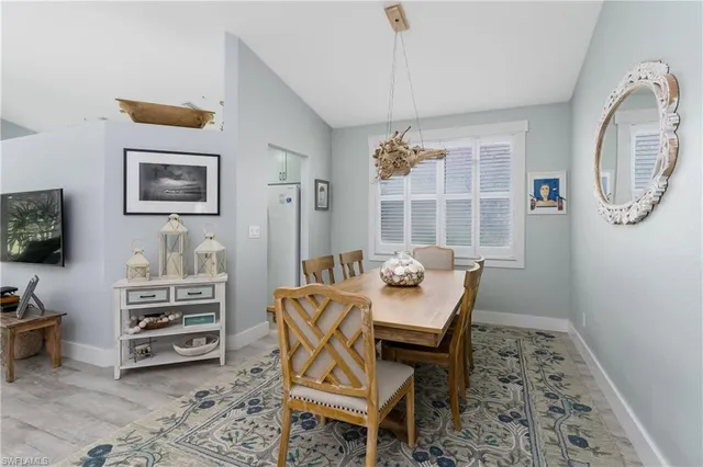 a view of a livingroom with furniture and a flat screen tv