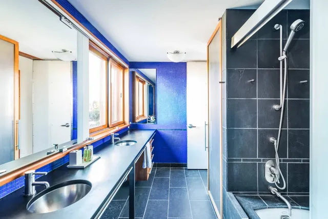 a kitchen with a sink and a wooden floor