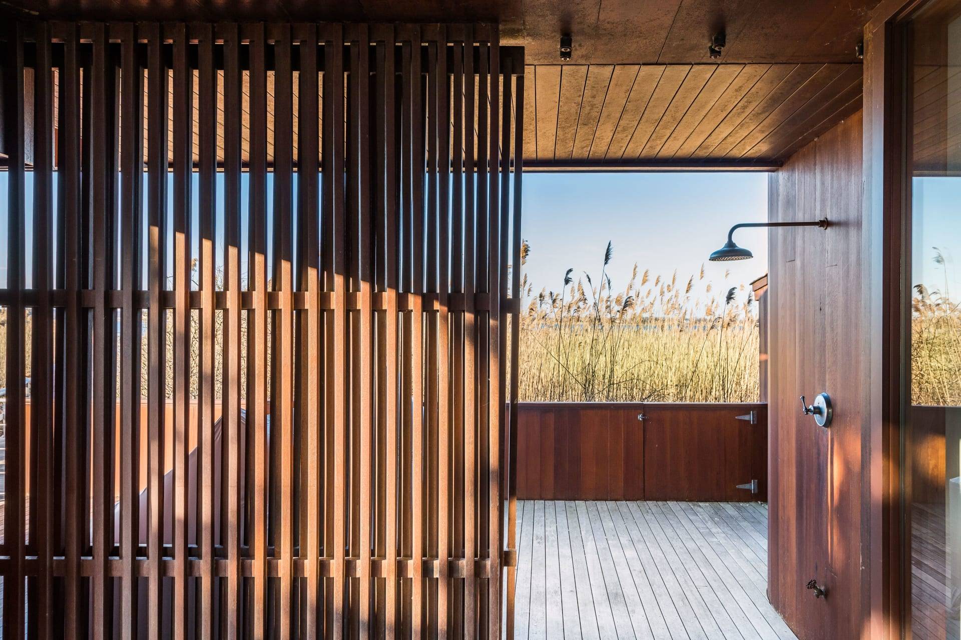 360 Dune Road Bridgehampton, NY 11932 - Photo 16 of 20 a view of a balcony with door