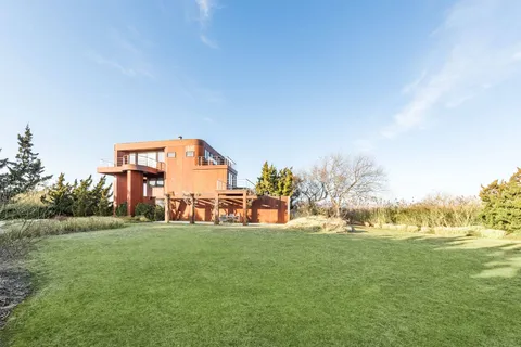 a view of a park with large trees