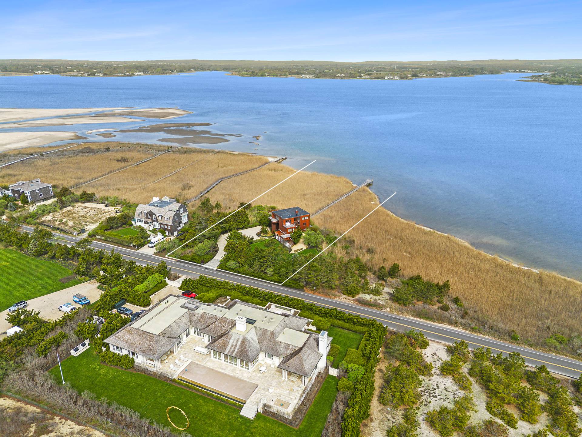 360 Dune Road Bridgehampton, NY 11932 - Photo 2 of 20 a view of an ocean and a mountain