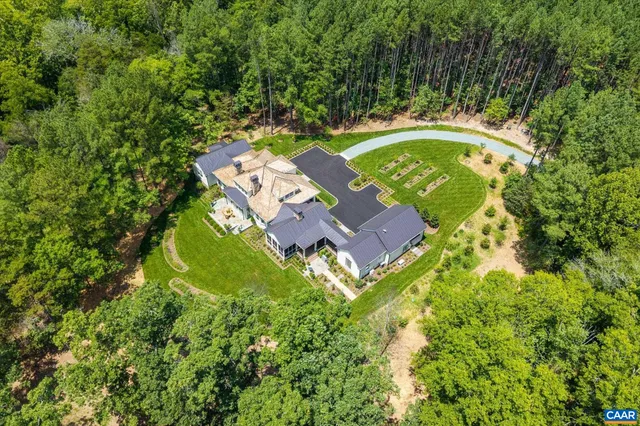 a bedroom with furniture and a large window