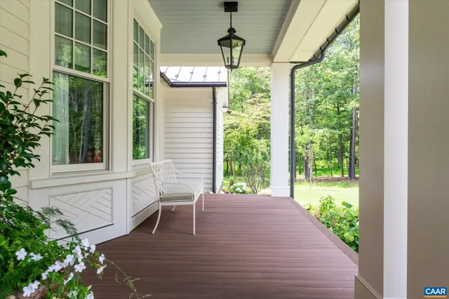 a dining table with chairs and window