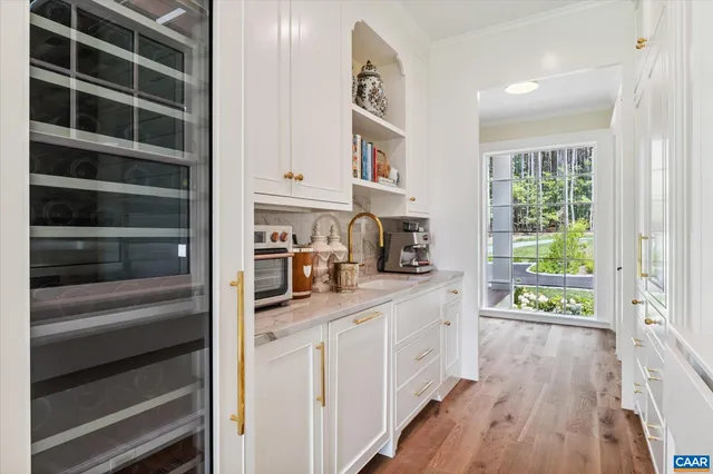 a bathroom with a granite countertop sink and a shower curtain