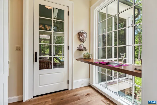 a living room with furniture and flowers